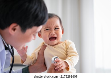 An Asian Baby Girl Who Is Afraid To See A Doctor For A Check-up. The Child Cried When He Saw The Doctor.