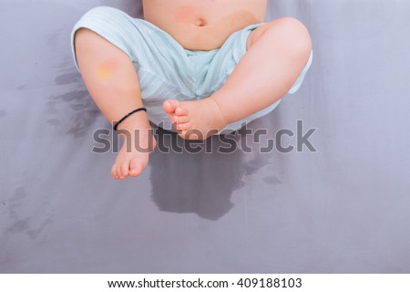 Asian baby happy lying after  bedwetting