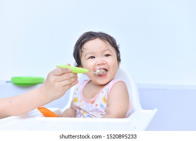 Asian Baby Kid Enjoy Eating With Happy On White Background