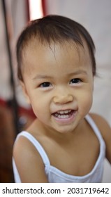 A Asian Baby Looking At Camera