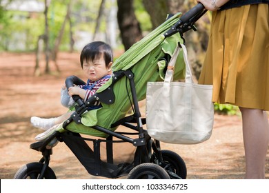 Asian Baby On Stroller