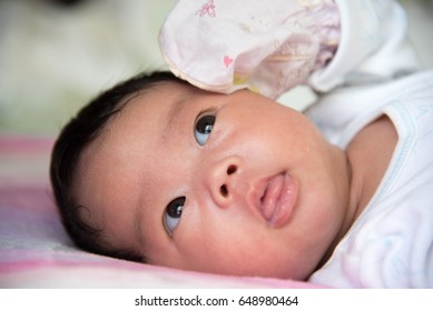 Asian Baby Sleeping In The Morning Light.