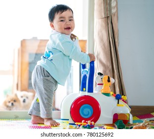 Asian Baby Training Walking With Walker Toy. This Immage Can Use For Baby, Family, Education, And Play Concept.