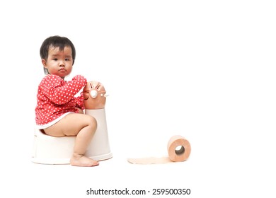 asian baby using and playing with toilet