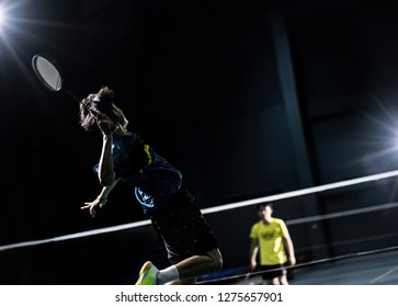 Asian Badminton Player Is Hitting In Court