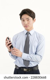 Asian Bank Teller With A Calculator