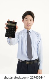 Asian Bank Teller With A Calculator 