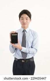 Asian Bank Teller With A Calculator 