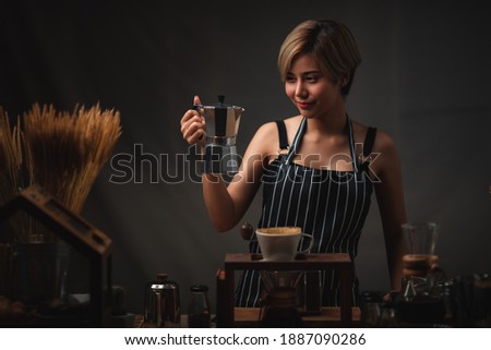 Asian barista girl making coffee, fresh coffee pouring filter drip tool