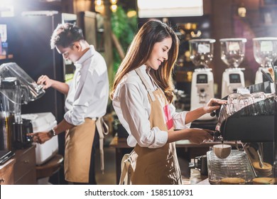 Asian Barista Preparing Cup Of Coffee, Espresso With Latte Or Cappuccino For Customer Order In Coffee Shop,making Espresso, Small Business Owner And Startup In Coffee Shop And Restaurant Concept