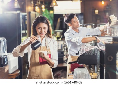 Asian Barista preparing cup of coffee, espresso with latte or cappuccino for customer order in coffee shop,bartender pouring milk,Small business owner and startup in coffee shop and restaurant concept - Powered by Shutterstock