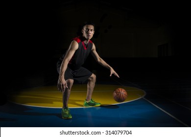 Asian Basketball Player Dribbling Ball