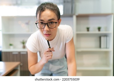 Asian Beautiful Business Woman Standing Thinking. Serious Female Professional Focus On Thinking About Information On Laptop And Put Pen On Face. Occupation Female Worker Think About Document She See.