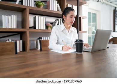 Asian Beautiful Businesswoman Working With Laptop And Coffee Cup In Co Working Space To Self Business