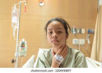 Asian Beautiful Female Patient Getting Sick And Fever, Having Sore Throat And Coughing While Lying On Bed In Hospital, Teenager Sick With Saline Intravenous, Healthcare And Health Insurance Concept.