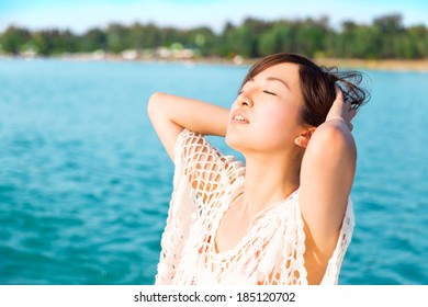 Asian Beautiful Girl Enjoying Sun On The Beach. Beauty.