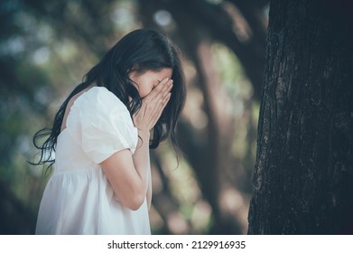 Asian Beautiful Girl Feel Alone In The Forest,Sad Woman Concept,Thailand People,Lady Sadness About Love From Boyfriend,She Feeling Broken Heart