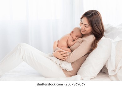 Asian beautiful mother motherhood  lie down nursing, looking newborn baby, gently hold infant together on chest with love bonding, toddler sleep leisure comfortable safe protection by mom taking care - Powered by Shutterstock