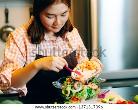 Asian beautiful woman during make the spaghetti food in the kitchen