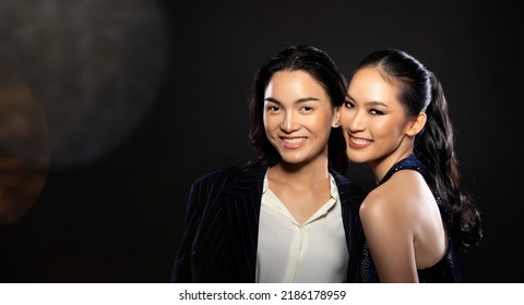 Asian Beautiful Woman And Man Wear Formal Blazer Evening Gown Hold Hug Together And Express Feeling Smile Happy For Dinner Gala Over Black Background Copy Space, Young Adult Rich Luxury Lovers Couple