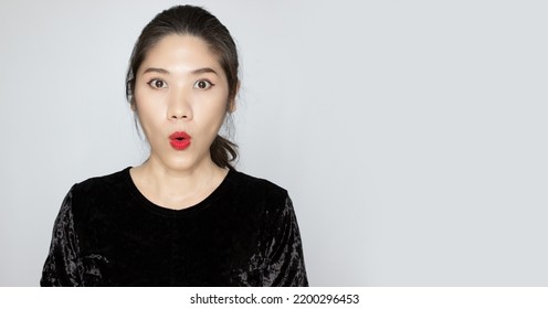 Asian Beautiful Woman Is Puckering Lip With Amazed, Surpised, Unbelievable Face To Know Promotion Sale Or News