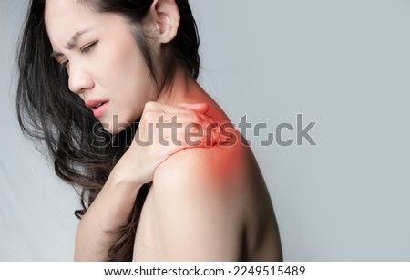 Asian beautiful woman is rubbing shoulder with feeling ache from office syndrome or muscle injure