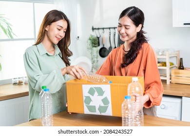 Asian Beautiful Woman Separating Trash For Further Recycling At Home. Attractive Female Put Plastic Bottles Into Recycle Box For Ecologically Friendly And Saving The Environment. Zero Waste Concept.