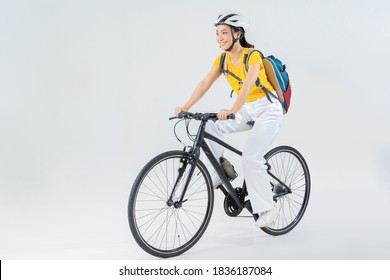 Asian beautiful woman, she is riding a city bike to work.studio concept