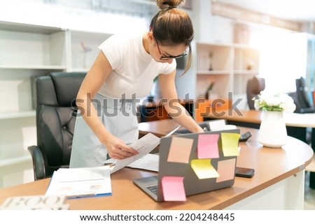 asian beautiful woman tired on business work. young adult exhausted office woman work late  at workplace feel alone and sad. quite serious sad female worker think about life after over work at office.