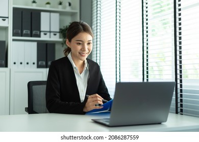 Asian Beautiful Woman Video Call With Hr Manager For Job Interview. Beautiful Girl Use Laptop Computer For Virtual Online Conference Discuss And Show Resume To Office Worker Man To Apply Job For Work.