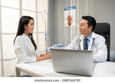 Asian beautiful woman visit and consult health problem with doctor.  Mature therapist practitioner working to explain diagnosis and give treatment to sick woman during appointment in clinic hospital. - Powered by Shutterstock