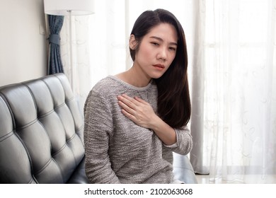 Asian Beautiful Women Touch Chest Heart Attack Symptom. Pain From Heart Stroke Healthcare And Medical Concept.