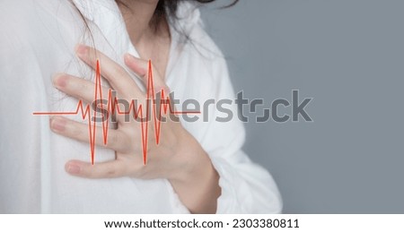 Asian beautiful Women touch chest heart attack symptom. Pain from heart stroke with heart rate pulse line. Healthcare and medical concept.