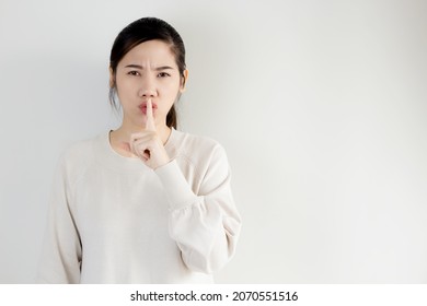 Asian Beautiful Women Use Finger Touch Her Lip With Pucker Up Lips To Keep Secret And Silence 