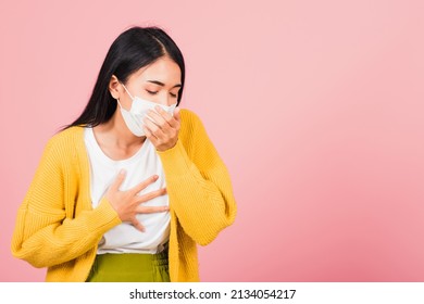 Asian beautiful young woman wearing medical mask protection for prevent infection coronavirus, COVID-19 she cough sneeze, studio shot isolated on pink background, Medical health care concept - Powered by Shutterstock