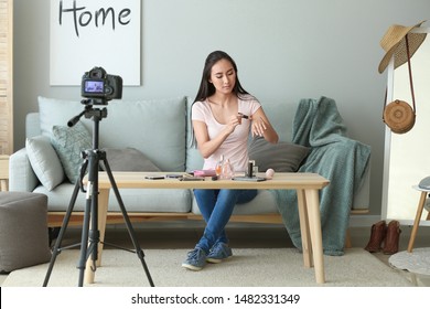 Asian beauty blogger recording video at home