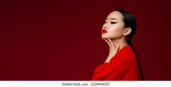 Asian Beauty Fashion Portrait. Profile View Of Korean Young Girl With  Makec Up Posing Against Red Background