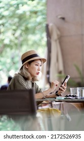 Asian Beauty Sitting Outside Coffee Shop Playing Smart Phone