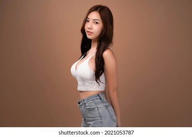 Asian beauty woman with natural makeup, cosmetic and plastic surgery concept, Isolated mocha brown background
