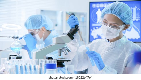 asian biotechnology scientist team take test tube to conduct experiments in the laboratory - Powered by Shutterstock