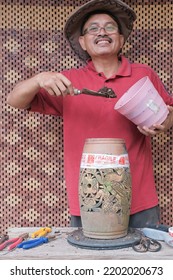 Asian Bonsai Artist Repotting A Bonsai Tree. Bougainvillea Tree.