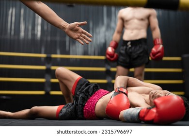 Asian boxer athlete man knocked out unconscious and laying down on floor center stage ring. Hand of referee counting down knockout. Sportsman muay Thai boxer training, work out at the gym. - Powered by Shutterstock