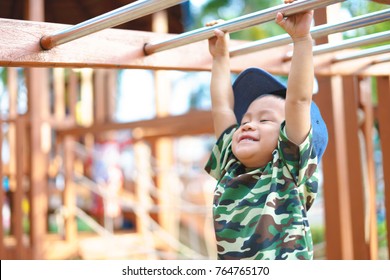 Asian Boy About 1 Year And 9 Months In Military Suit Playing At Kid Training Playground For Muscle Development