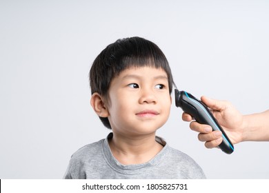 Asian Boy About 4 Year Old Got Hair Cut At Home By His Mother With Electric Cordless Clippers