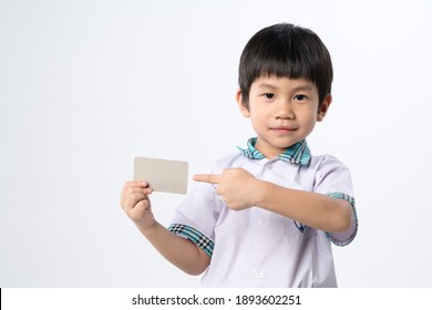 Asian Boy About 4 Years Old Holding Paper Credit Card Mockup For Identification Or Bank On White Background