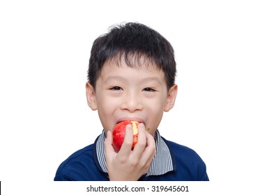 Asian Boy Eating An Apple Over White Background