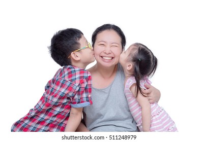 Asian Boy And Girl Kissing Their Mother Over White Background