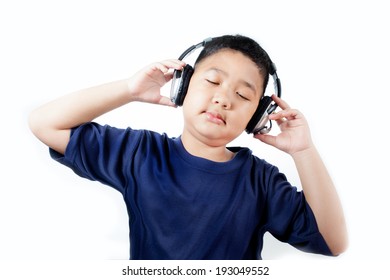 Asian boy with headphones listening to music.