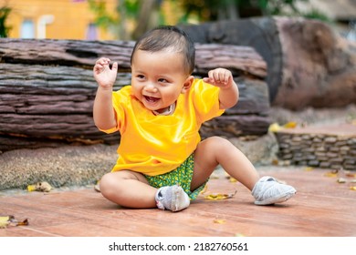 Asian Boy Laughing Smile With Milk Teeth For The First Time And Have Fun Playing In The City Park