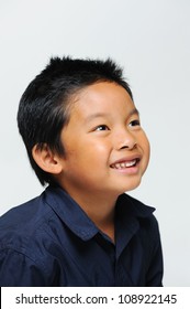 Asian Boy Looking Up And Smiling